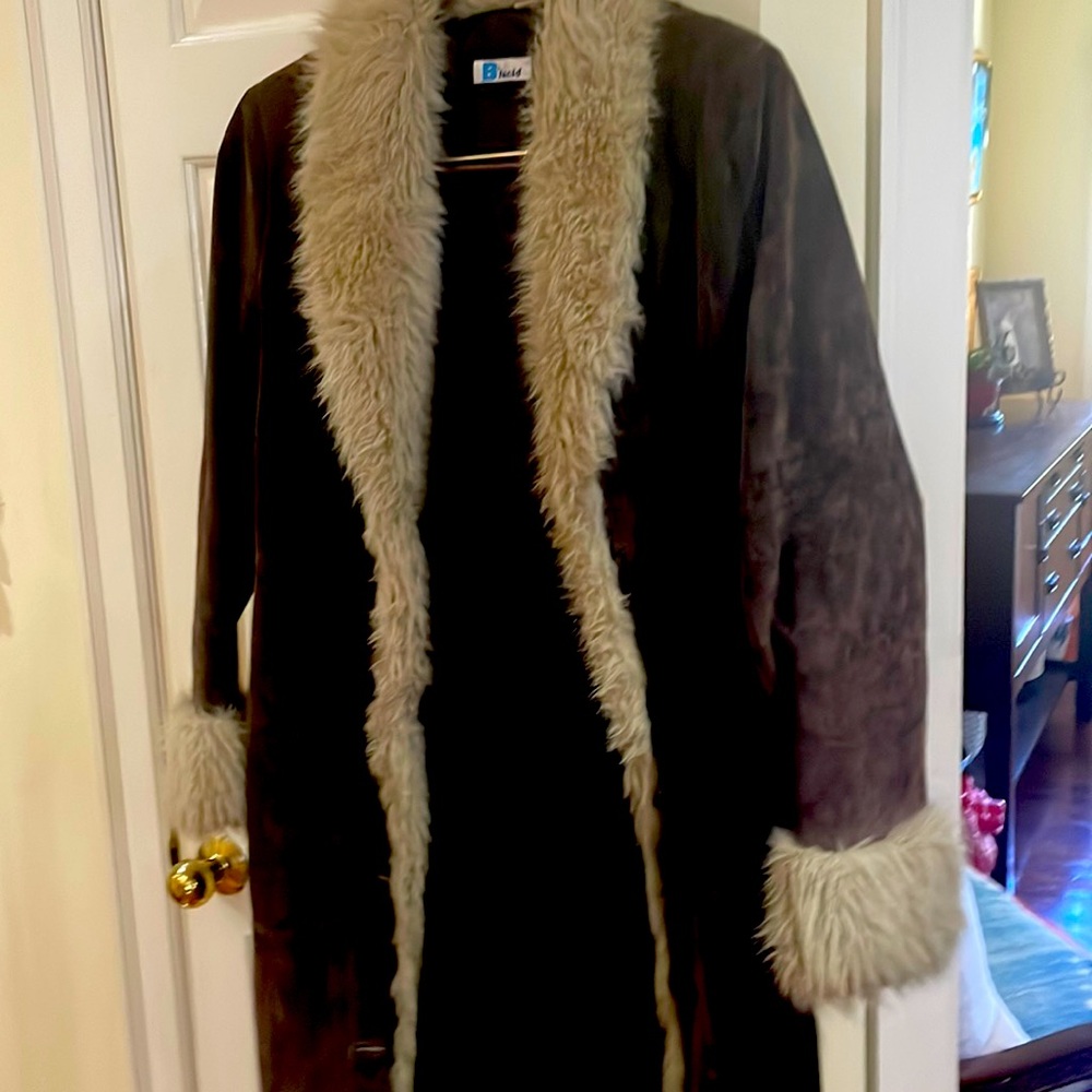 Brown long leather faux trimmed  jacket. No tears. Clean. Non smoking home.